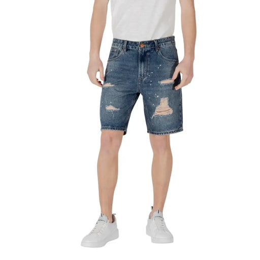 Distressed denim shorts with paint splatter design for casual summer wear