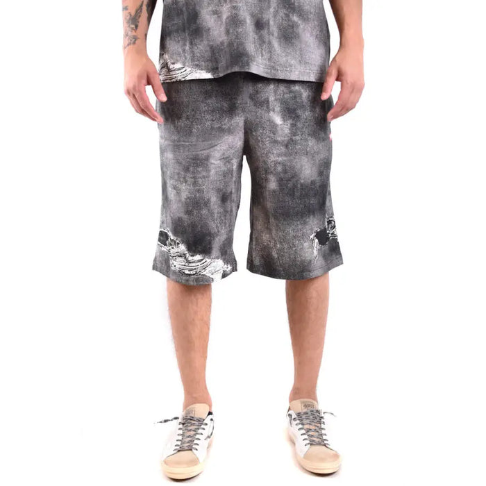 Distressed gray denim shorts displayed in a product listing with stylish casual design