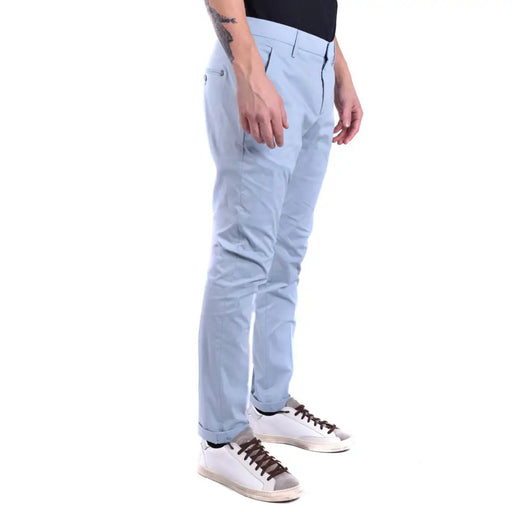 Light blue slim-fit men’s chinos with brown-laced white sneakers from Dondup Men