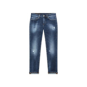 Dondup Jean en coton bleu déchiré pour femme, avec un délavage foncé subtil et des empiècements usés sur les cuisses.