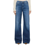 Woman wearing light-colored long-sleeve shirt and high-waisted blue wide-leg Dondup jeans