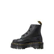 Bottines Dr. Martens en cuir noir pour femme, montrant la tige en cuir texturé vue de l'arrière