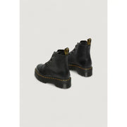 Bottines Dr. Martens en cuir noir pour femmes, vues de l'arrière, mettant en valeur la texture du cuir
