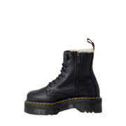 Black leather dr martens ankle boots for women shown from the back side highlighting durable leather material