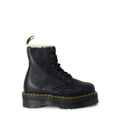 Dr Martens black leather ankle boots for women shown from the back side featuring durable leather material