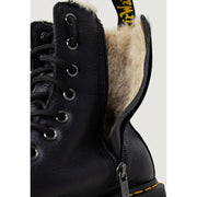 Black leather dr martens ankle boots for women shown from the back side with signature stitching and sole
