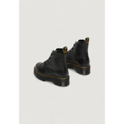 Dr martens black leather ankle boots for women shown from the back side highlighting the leather texture