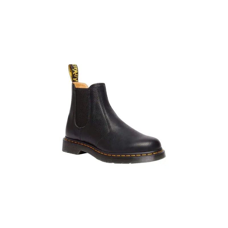 Bottines Dr Martens pour homme en cuir noir avec surpiqûres jaunes et languette de tirage visible à l'arrière