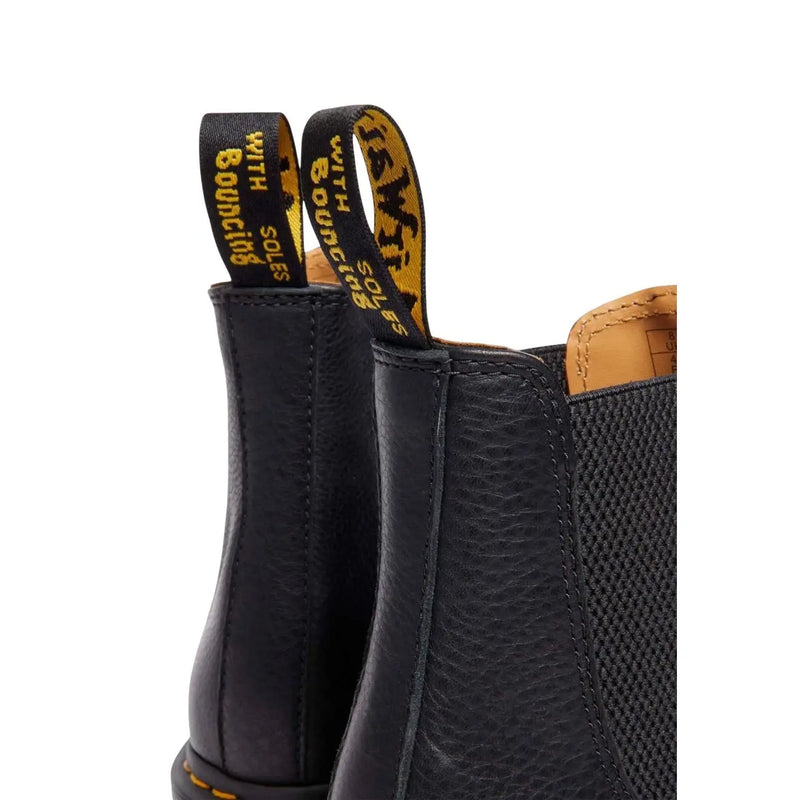 Dr Martens men leather ankle boots black with textured leather upper tan lining and yellow branding on pull tabs