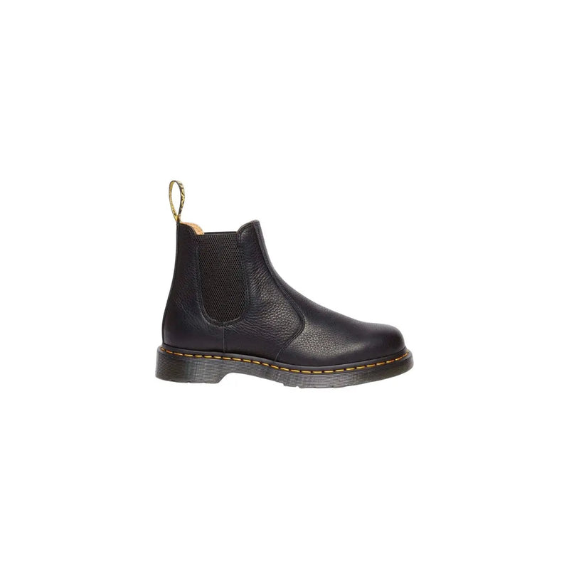 Black leather dr martens men chelsea ankle boot with pebbled texture elastic side panels and gold pull tab