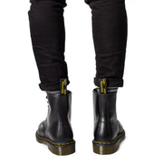 Black leather Dr Martens men lace up boots showing the back side in style number 11822006