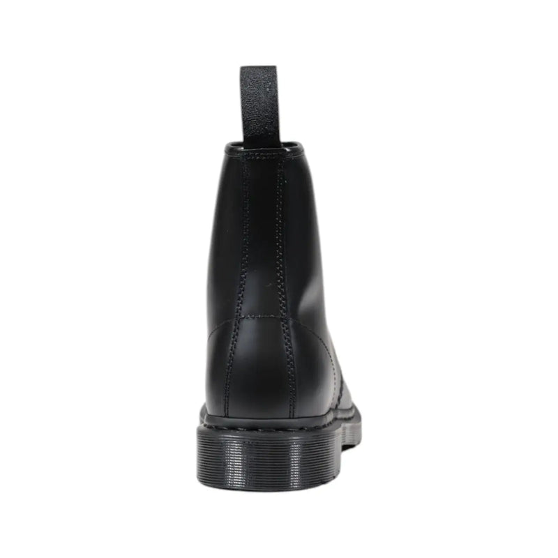 Bottes Dr. Martens homme en cuir noir à lacets, montrant l'arrière avec une semelle résistante et des coutures jaunes.