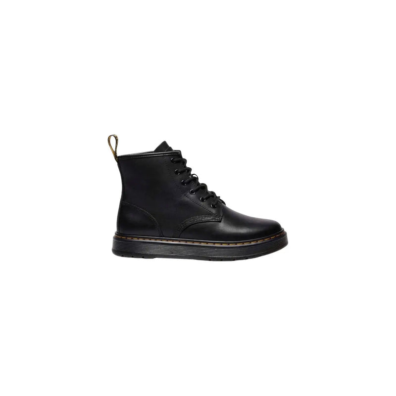 Bottines chukka Dr Martens pour homme en cuir noir, présentant une texture de cuir noir détaillée et un design classique