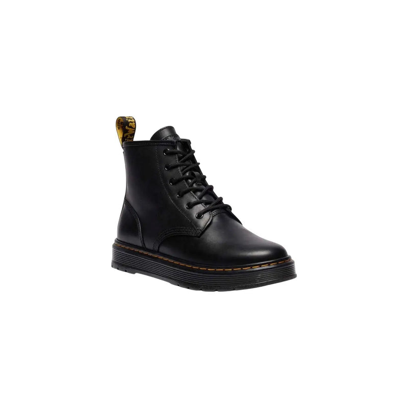 Bottines chukka Dr Martens pour homme en cuir noir, vues de dos, mettant en valeur la finition lisse du cuir et la hauteur cheville.