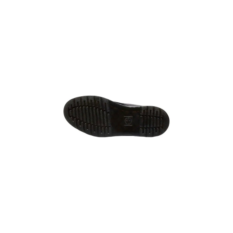 Semelle en caoutchouc noir avec semelle crantée et petit logo embossé près du talon des bottines chukka en cuir noir Dr. Martens pour homme