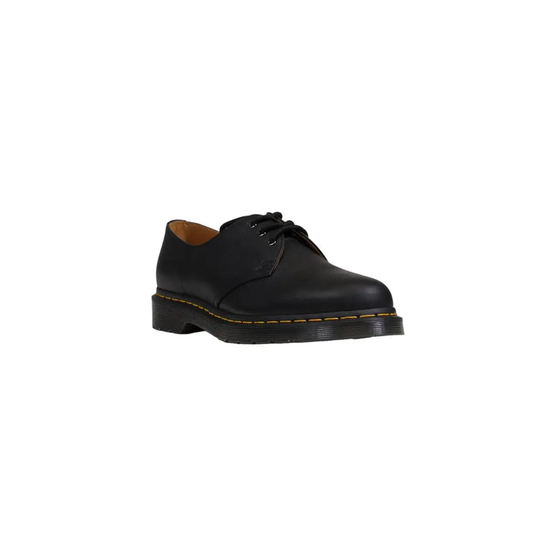 Chaussures Dr. Martens pour homme en cuir noir, modèle classique 1461, présentant une tige en cuir noir et un design classique à lacets.