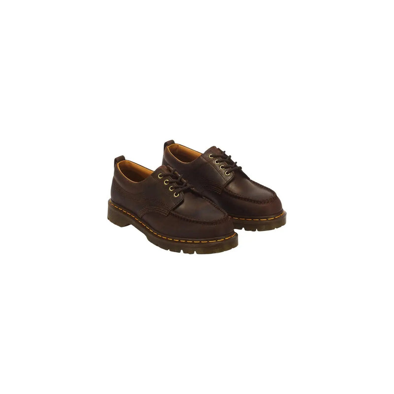 Bottes Dr. Martens pour homme en cuir marron, modèle Lowell, montrant l'arrière de la chaussure.