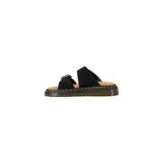 Pantoufles Dr Martens pour homme en cuir noir, à boucle et bout ouvert, avec brides à deux brins en daim noir, semelle intérieure beige et surpiqûres jaunes.