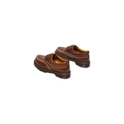 Chaussures Dr Martens Lowell pour homme, en cuir marron caramel, à lacets, avec surpiqûres jaunes et semelle épaisse en caoutchouc.