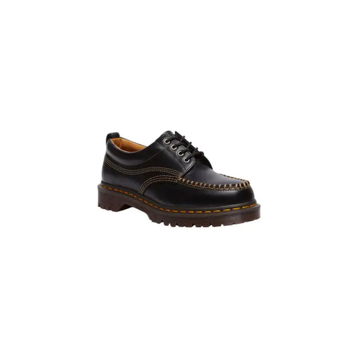 Mocassins Dr. Martens Lowell pour homme en cuir noir, montrant l'arrière en cuir résistant.