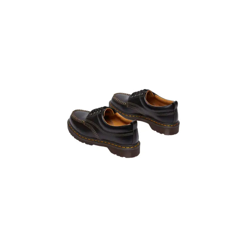 Mocassins Dr. Martens Lowell pour homme en cuir noir, alliant design élégant et matière résistante.