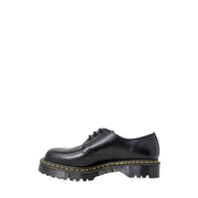Dr Martens men’s black leather lace-up shoes showing the back side with durable stitching and heel loop