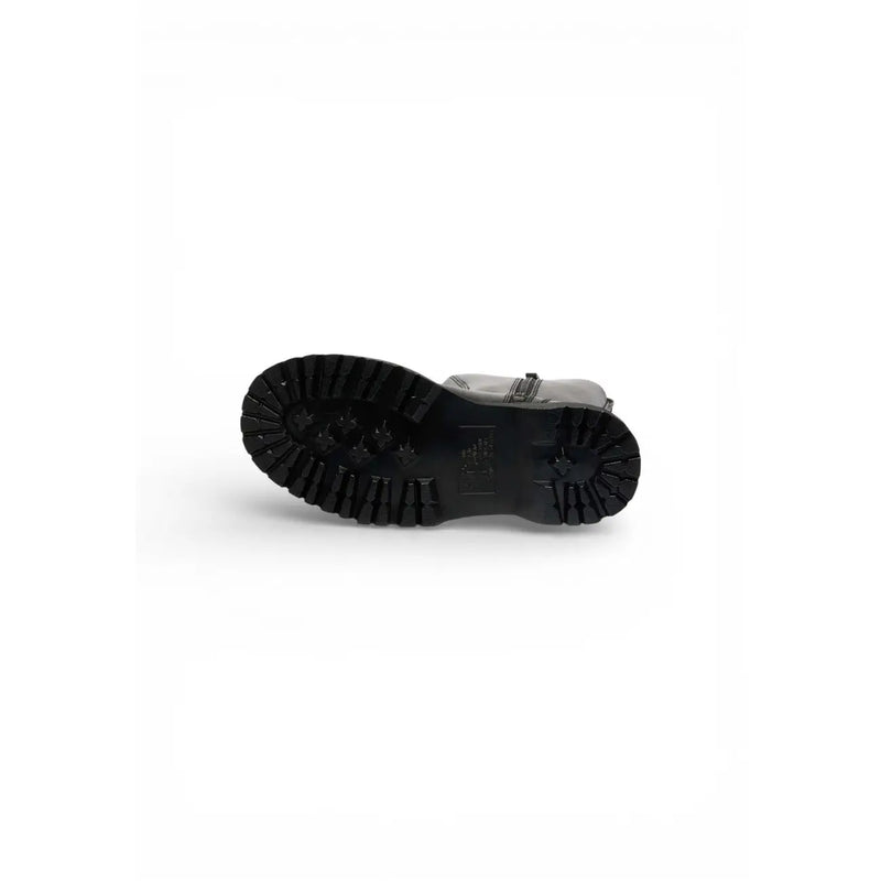 Black rubber sole with deep treads and embossed logo on back side of dr martens women black leather ankle boots zip