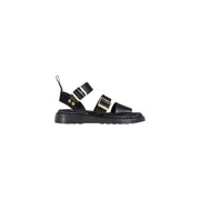 Dr Martens women black leather buckle sandals with gold-tone buckles and chunky rubber sole visible from the back