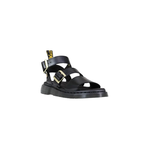 Sandales à boucle en cuir noir pour femmes de Dr. Martens, vues de l'arrière mettant en valeur la matière du cuir.