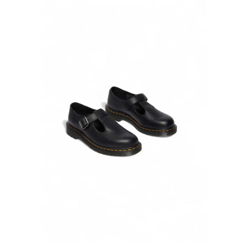 Dr martens women black leather slip on shoes shown from the back side featuring smooth leather finish