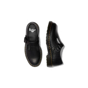 Dr Martens women black leather slip on shoes shown from the back with smooth black leather and slip on design