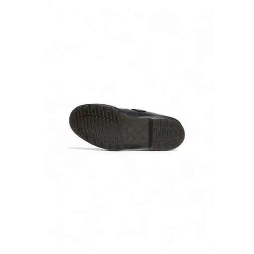 Semelle en caoutchouc noir avec rainures texturées pour une meilleure adhérence sur les chaussures Dr. Martens pour femmes en cuir noir à enfiler