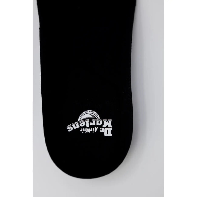 Dr Martens women black polyester shoes showing the back side with durable stitching and classic design details