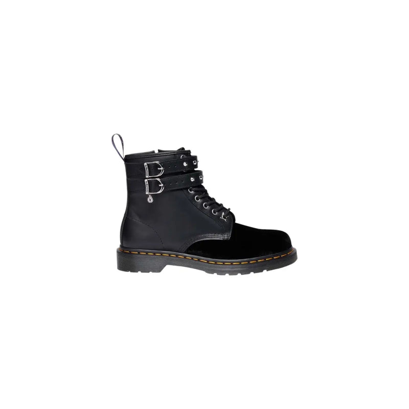 Black dr martens women boots in leather and velvet with a zip closure shown from the back side