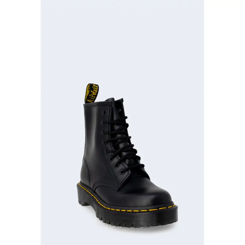 Dr Martens women’s black leather ankle boots shown from the back for fall and winter use