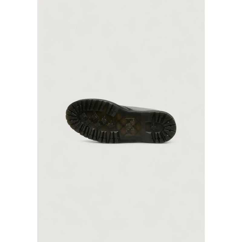 Black rubber sole with deep tread pattern and embossed dr martens logo on women’s black leather ankle boots for fall winter