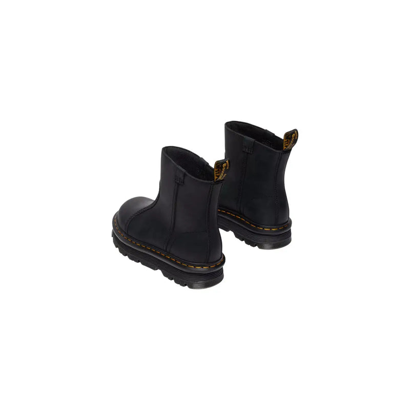 Dr Martens women’s black leather ankle boots showing the back side with durable stitching and heel loop