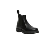 Dr Martens women’s black leather chelsea boot with pull tab and chunky rubber sole shown from back side