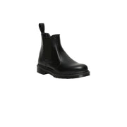 Dr Martens women’s black leather chelsea boot with pull tab and chunky rubber sole shown from back side