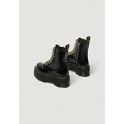 Dr Martens women’s black leather lace-up boots in black patent leather showing the back side of the boot