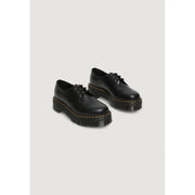 Black leather lace up dr martens women’s shoes shown from the back side with signature outsole and stitching