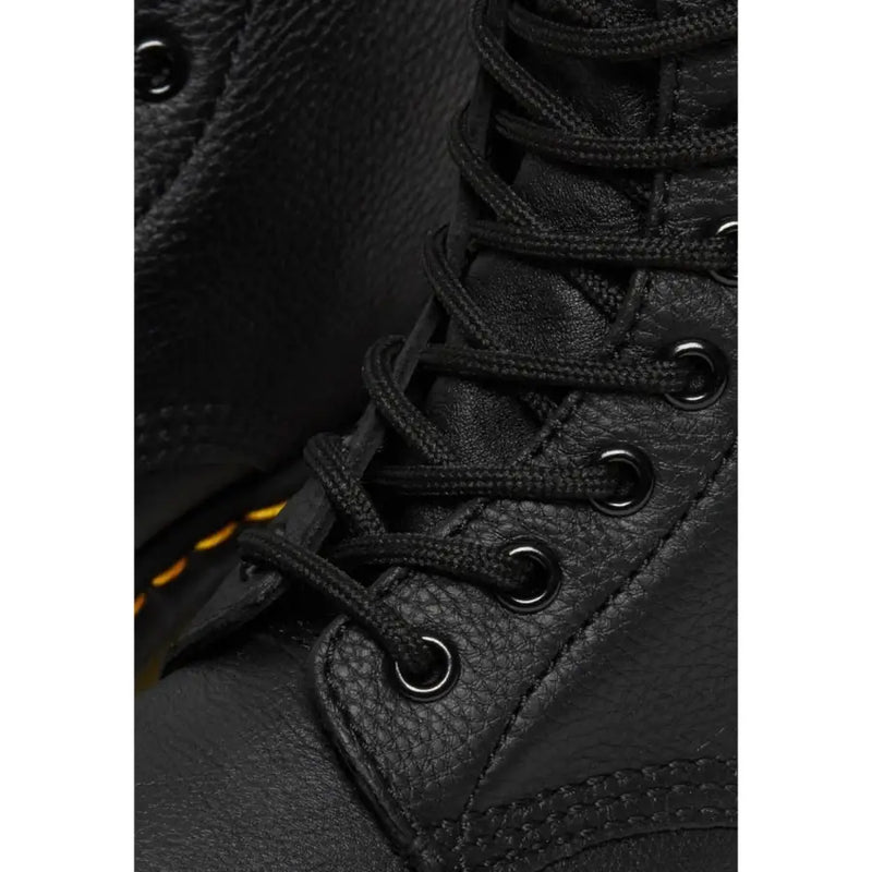 Dr Martens women’s fall winter black leather boots shown from the back side highlighting their durable design