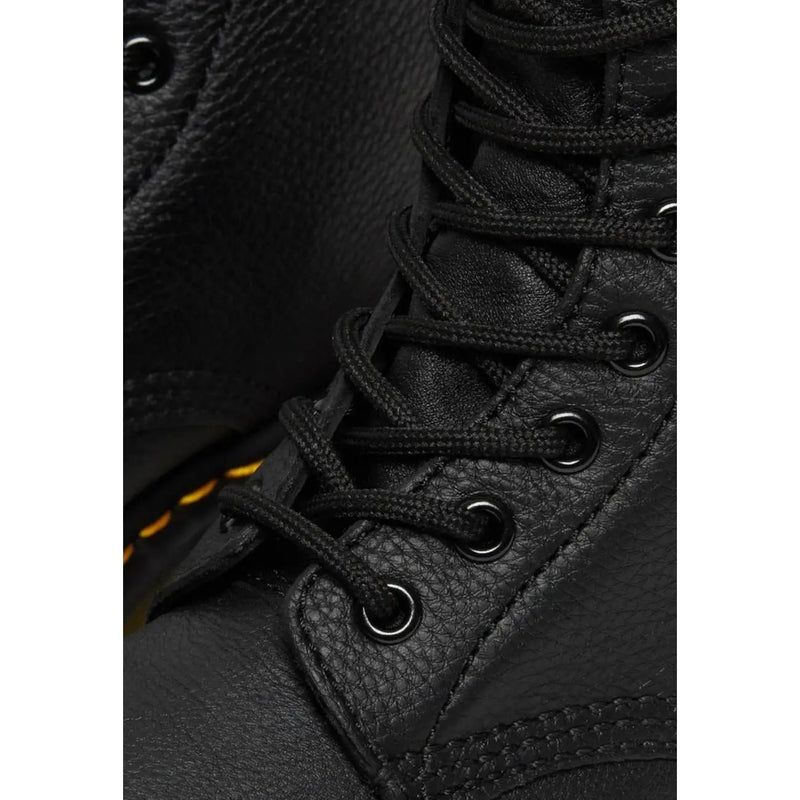 Dr Martens women’s fall winter black leather boots shown from the back side highlighting their durable design