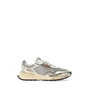 Silver metallic sneaker with mesh accents and white sole, inspired by prada’s run 100 model.