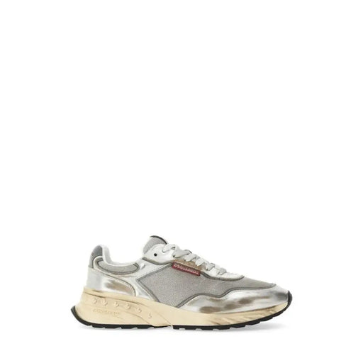 Silver metallic sneaker with mesh accents and white sole, inspired by prada’s run 100 model.