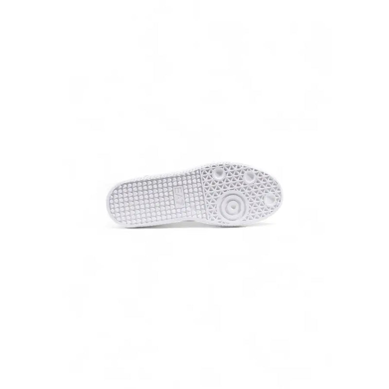 White rubber sole with textured grid and circular traction on ea7 black leather slip on sneakers for men