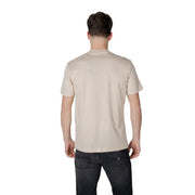 Men’s light beige short-sleeve cotton T-shirt paired with dark gray jeans for spring summer style