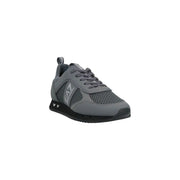 Ea7 Baskets grises en polyamide pour homme, à enfiler, avec empiècements en mesh et synthétiques et semelle en caoutchouc noir.