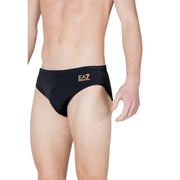 Black ea7 men swimwear swim trunks featuring gold logo detailing suitable for beach and pool use