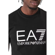 Emporio Armani EA7 homme noir t-shirt avec un logo blanc audacieux et l'emblème iconique de l'aigle sur la face avant